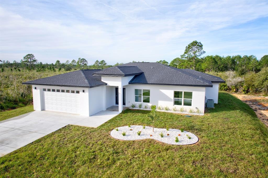 front view of a house with a yard