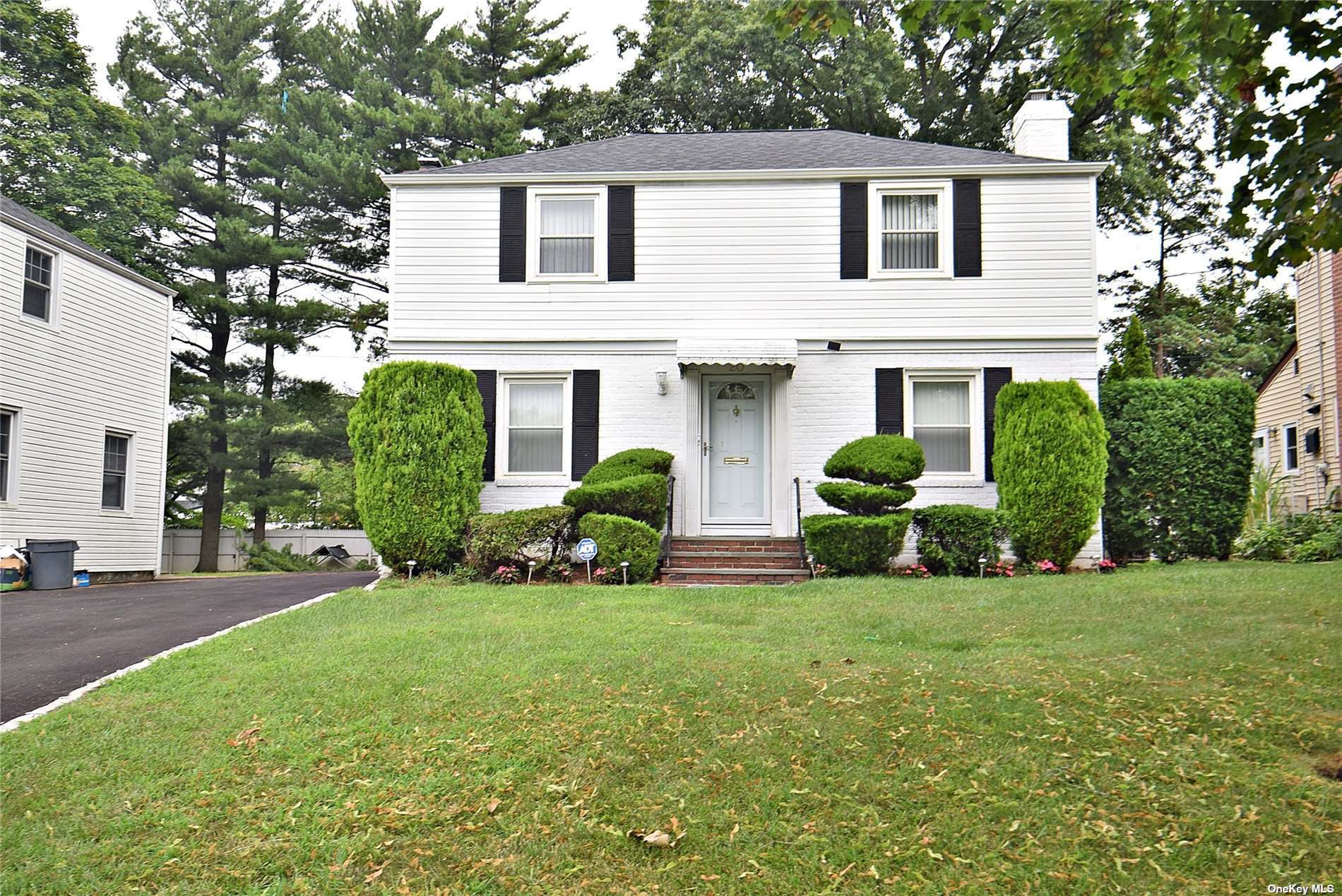 a view of a house with backyard sitting area and garden