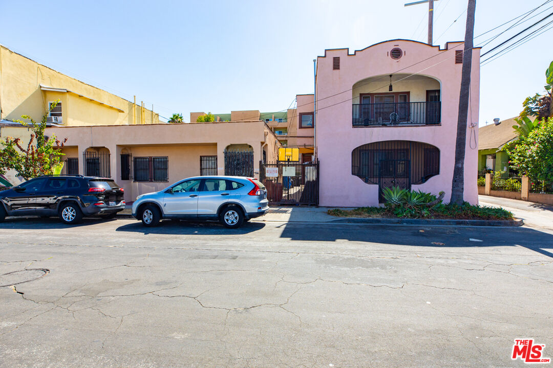 a front view of a house with parking space