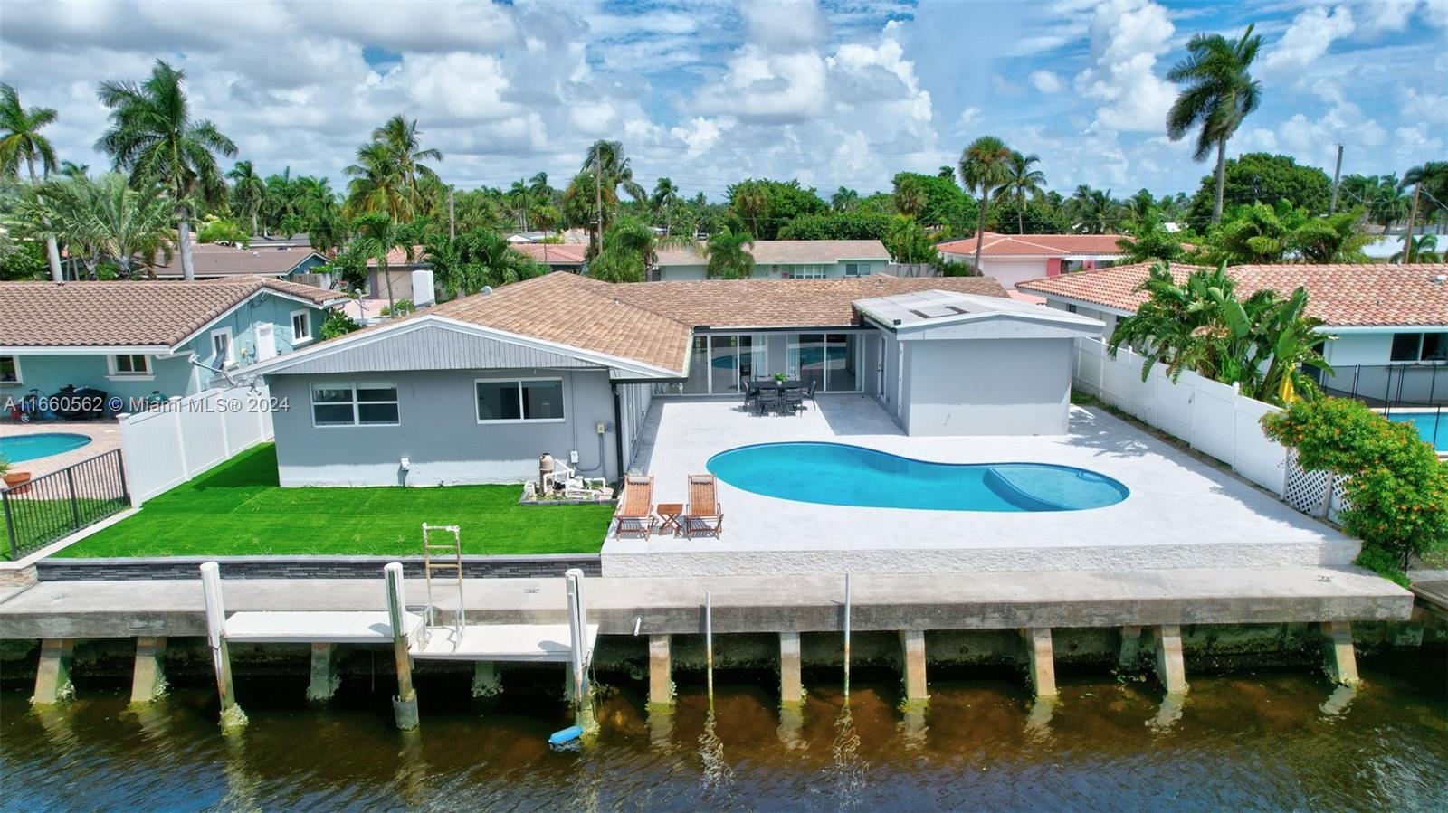 an aerial view of a house with a garden and plants