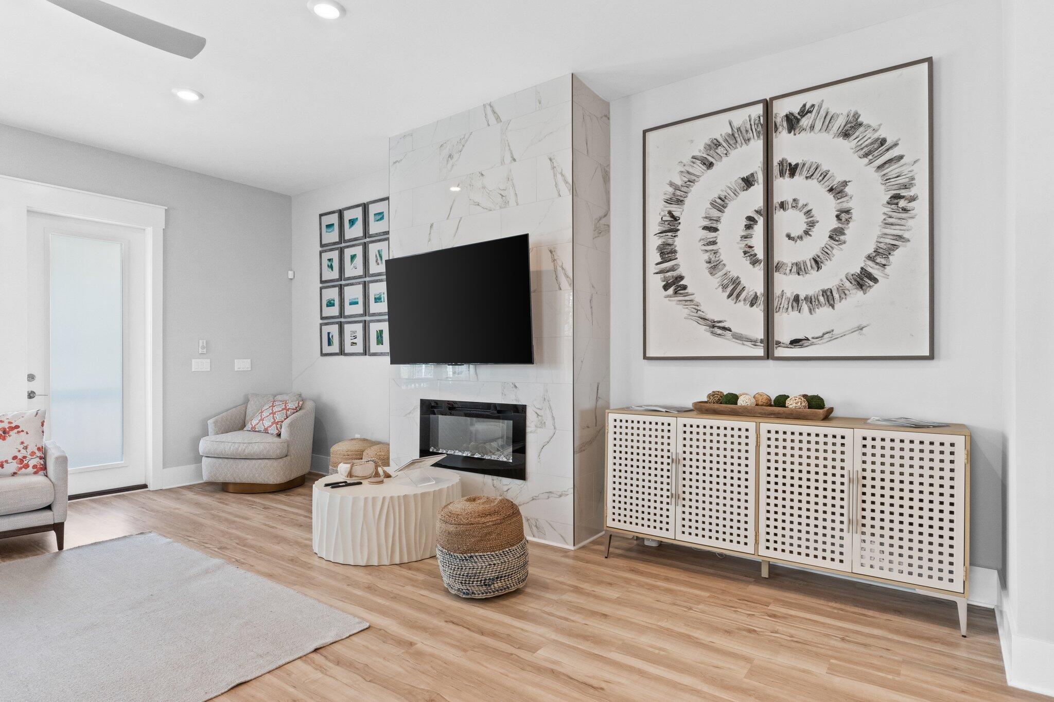 a living room with furniture and a flat screen tv