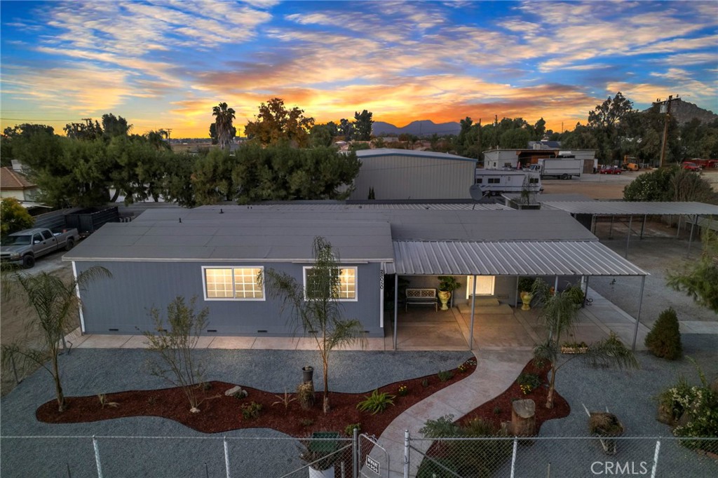 an aerial view of a house with swimming pool outdoor seating and yard