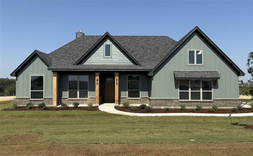 a front view of a house with swimming pool having outdoor seating