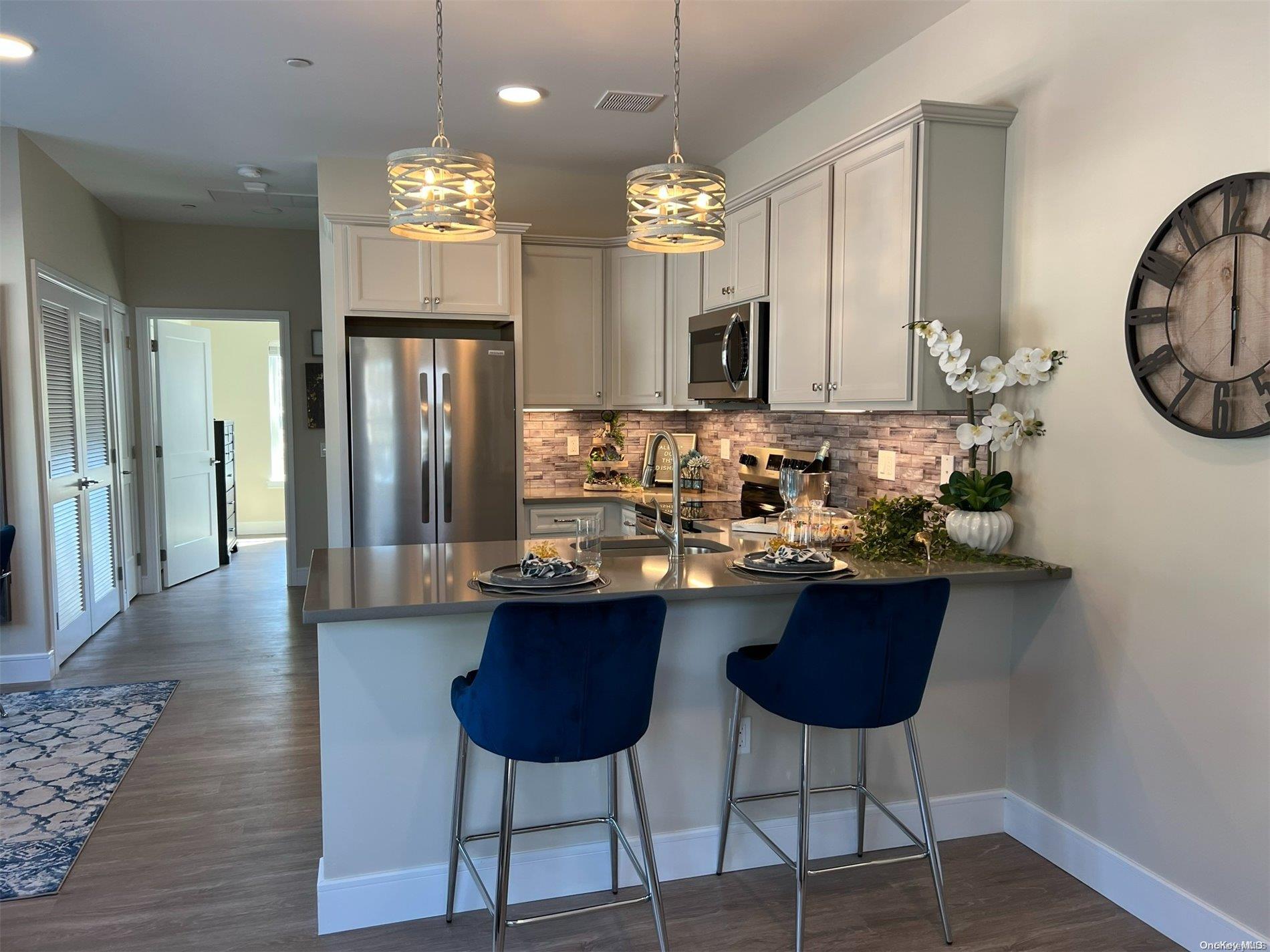 a kitchen with a table and chairs in it