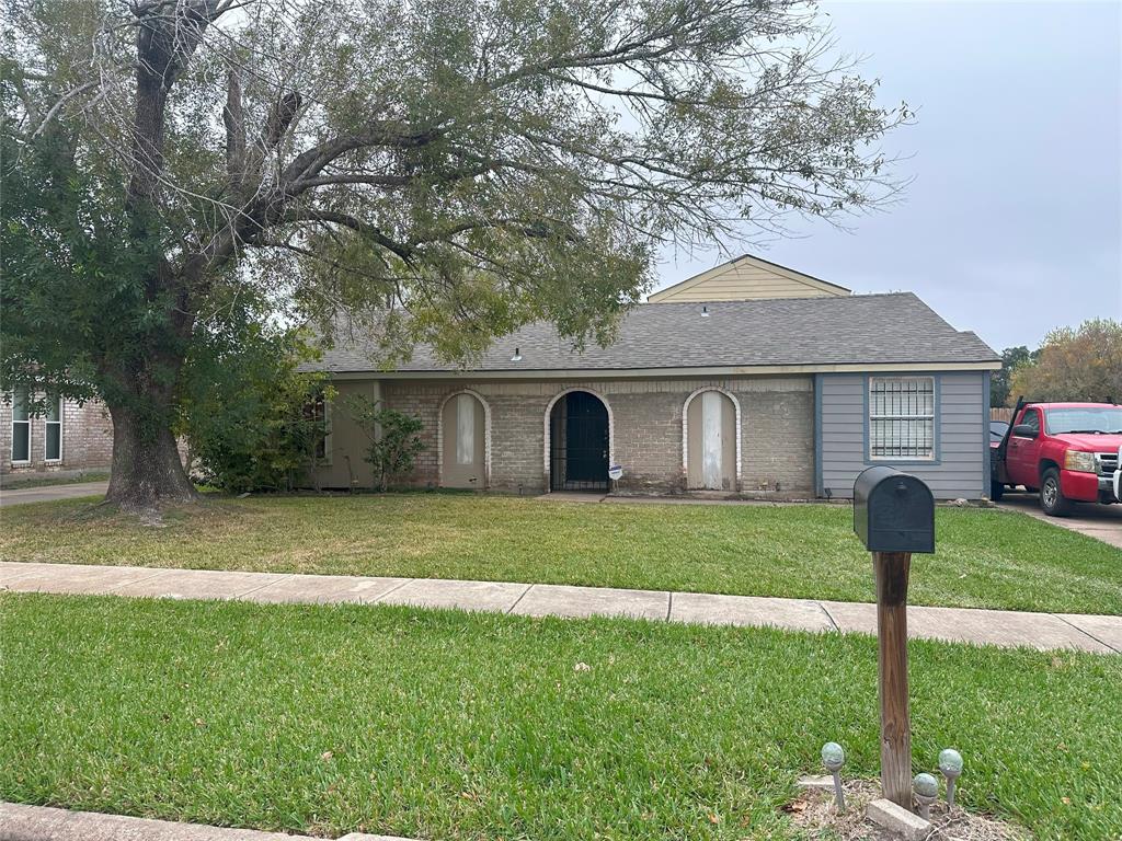 Charming single-story home with a brick exterior and a cozy front yard. Features a spacious driveway, mature trees, and a welcoming entrance. Ideal for comfortable living in a suburban neighborhood.