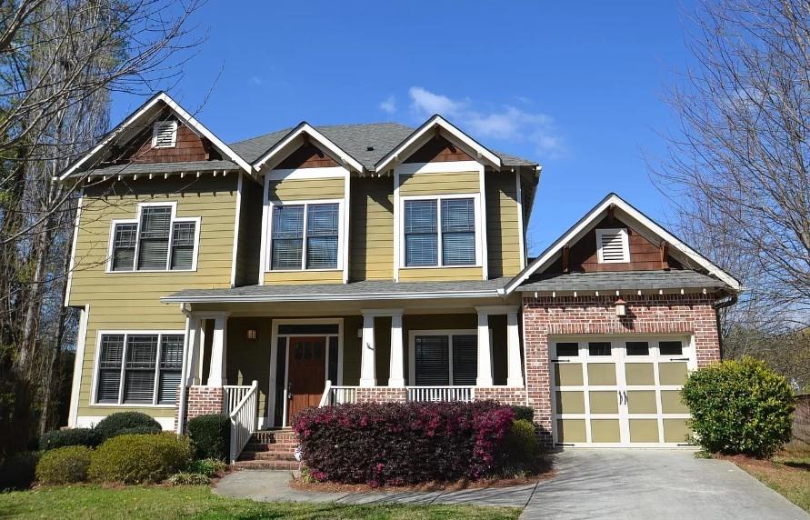 a front view of a house with a yard