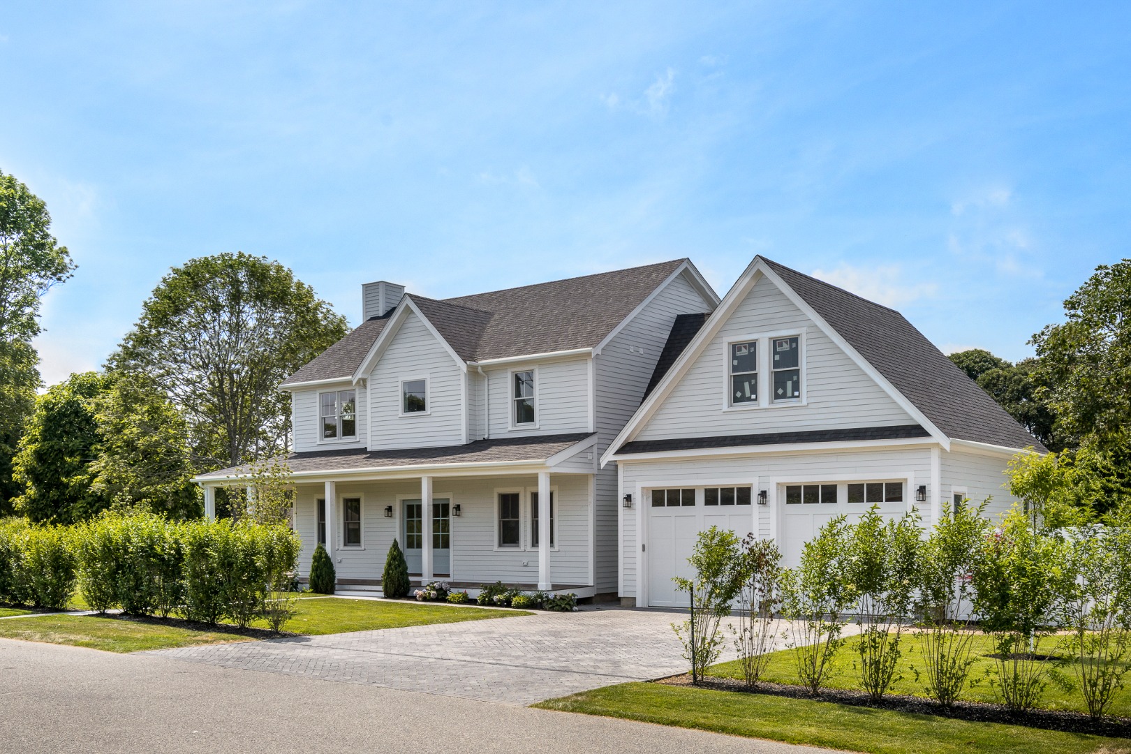 a front view of a house with swimming pool and porch