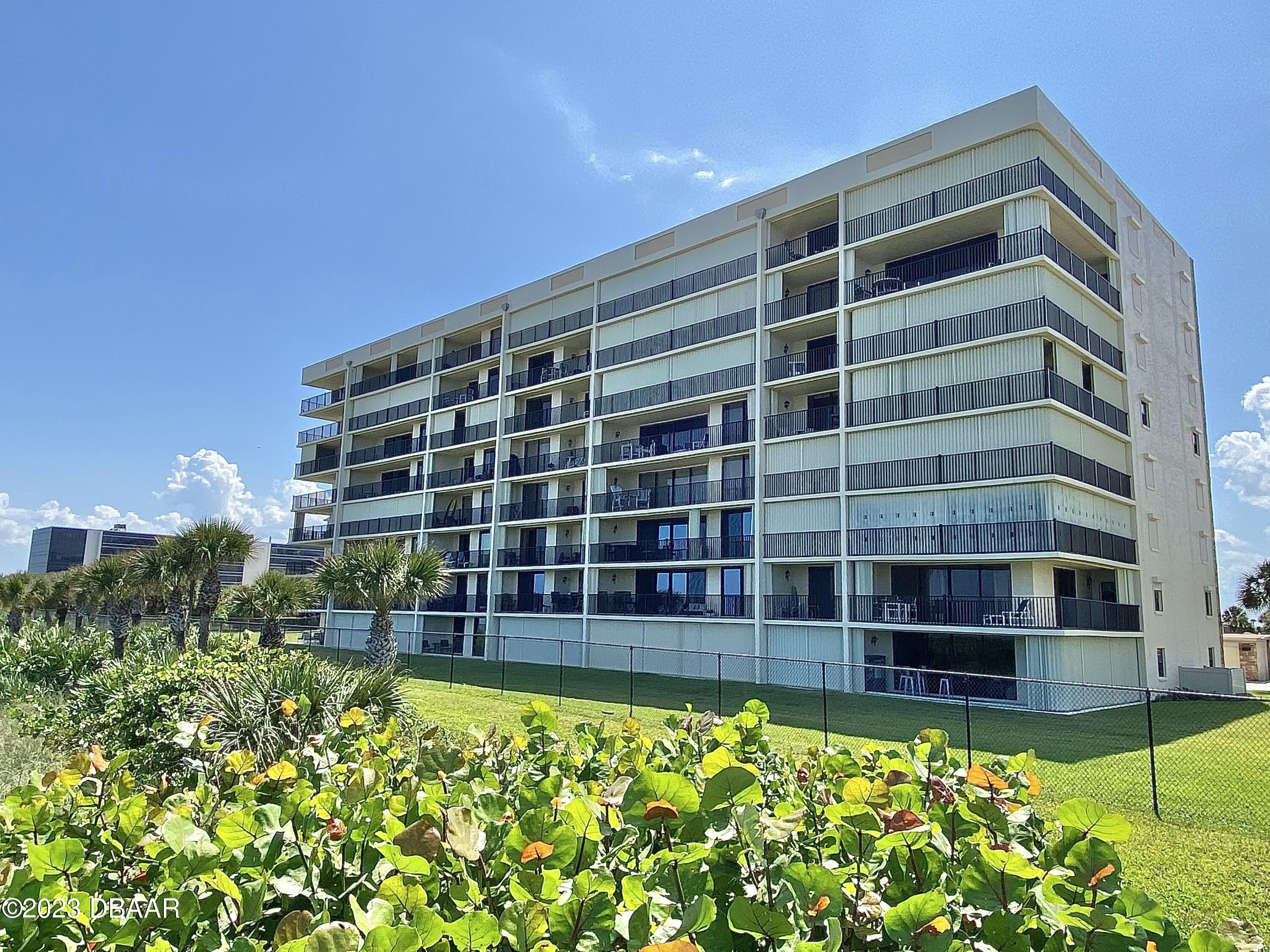 a view of a building with a garden