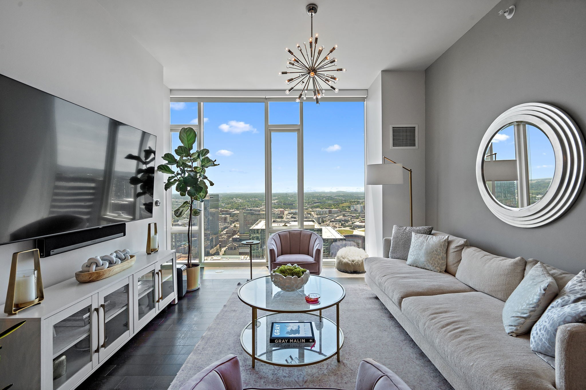 a living room with furniture and a large window