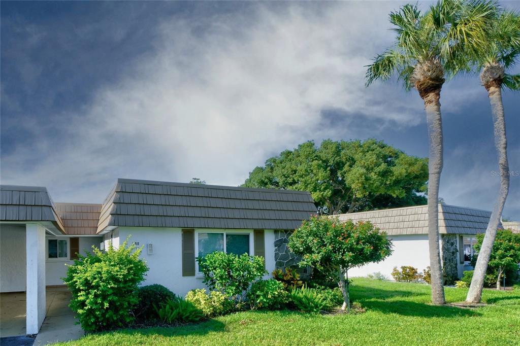 a house view with a garden space