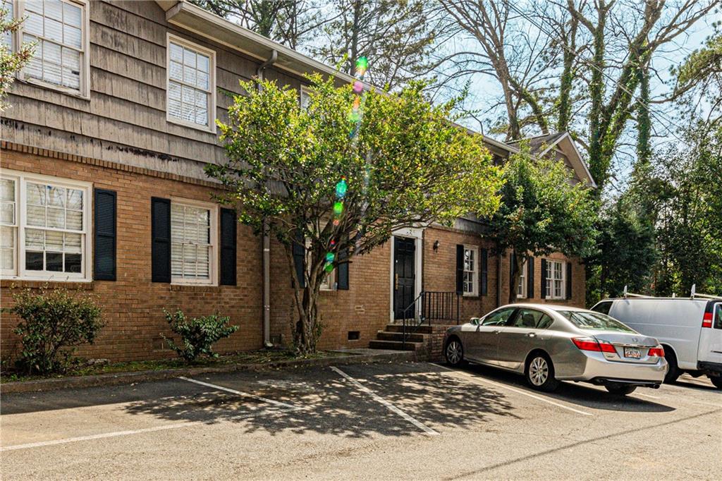 a view of a car parked in front of a house