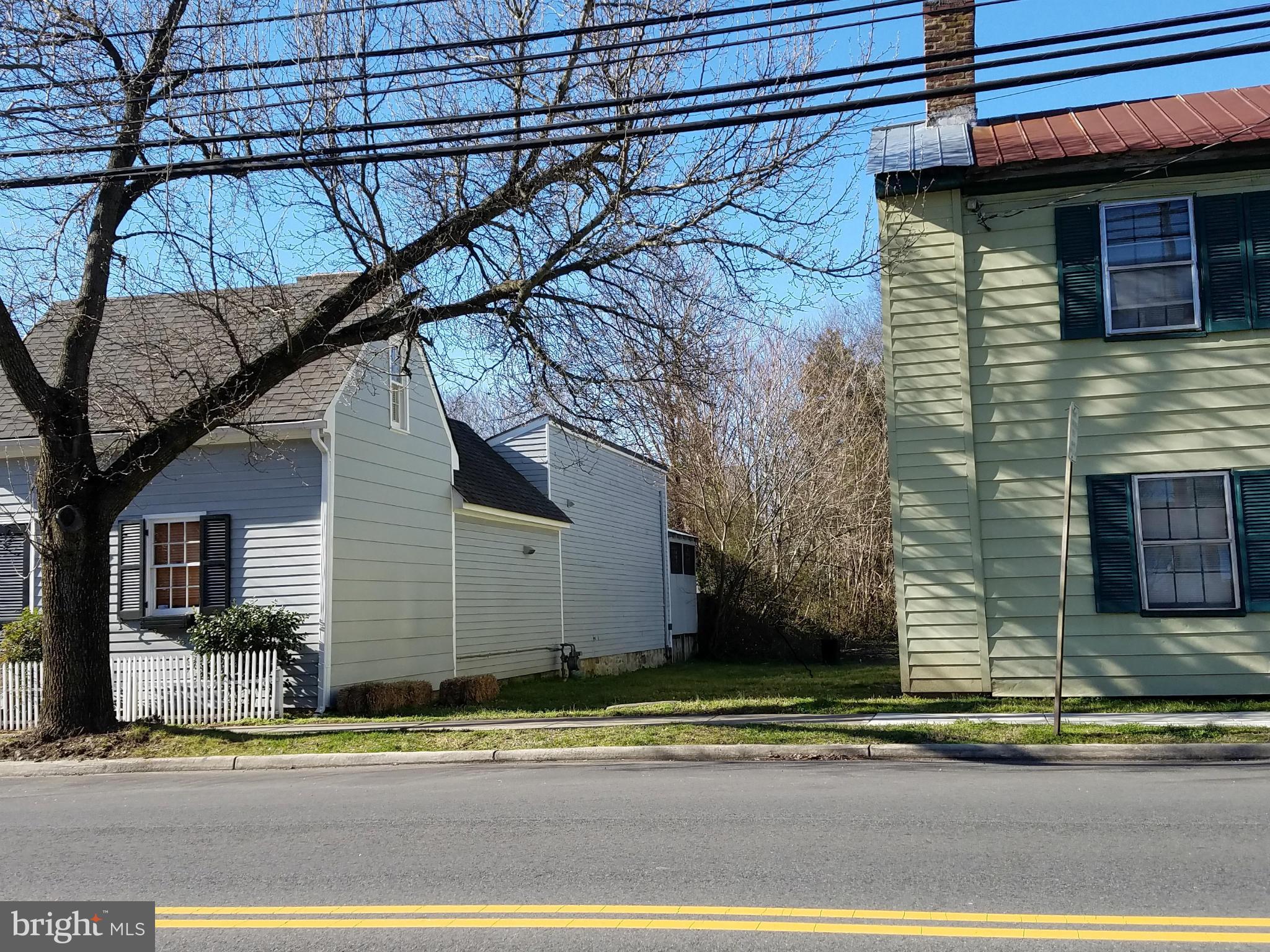 a view of a house with a road