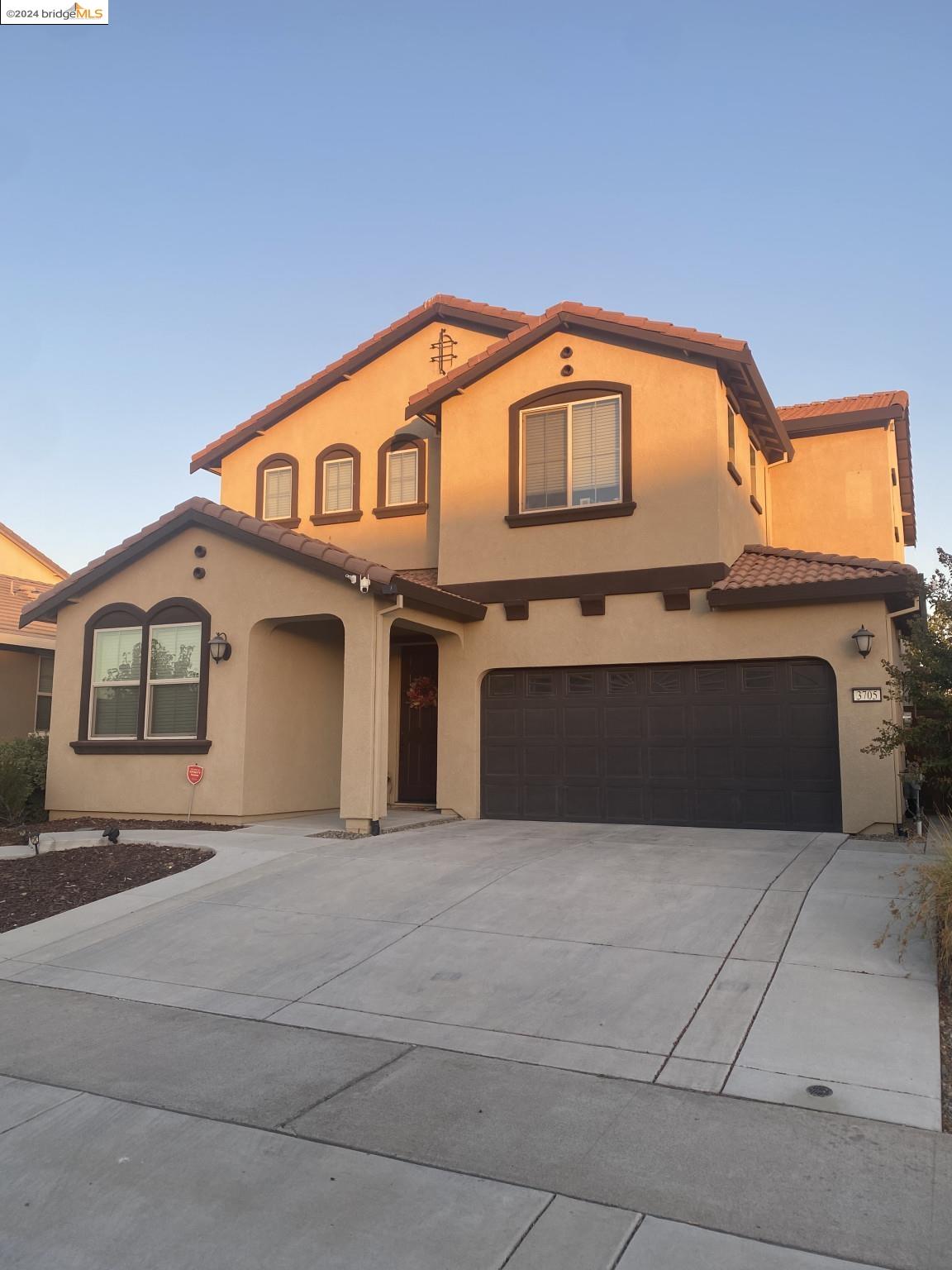 a front view of a house with a garage