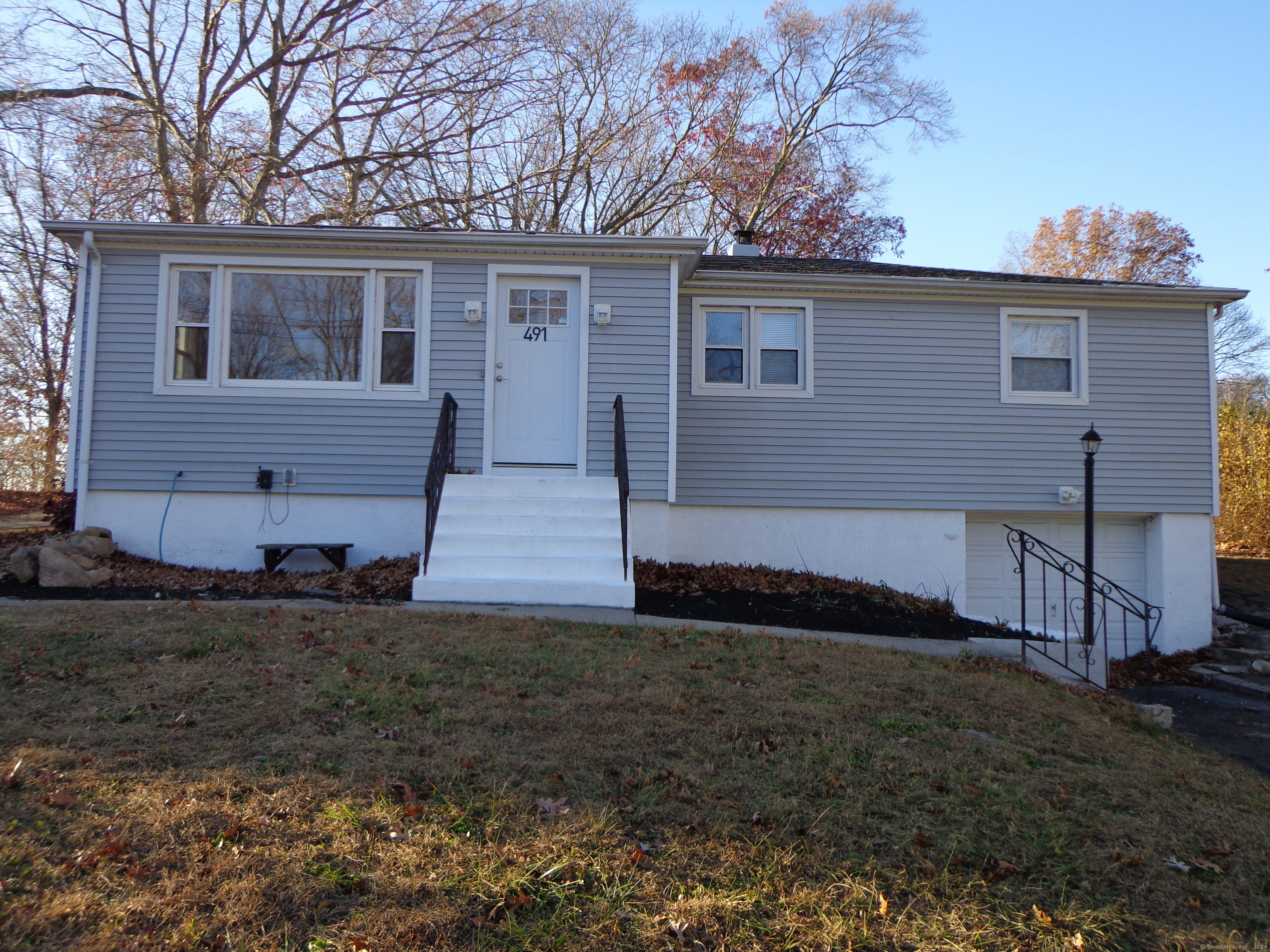 a view of a house with a yard