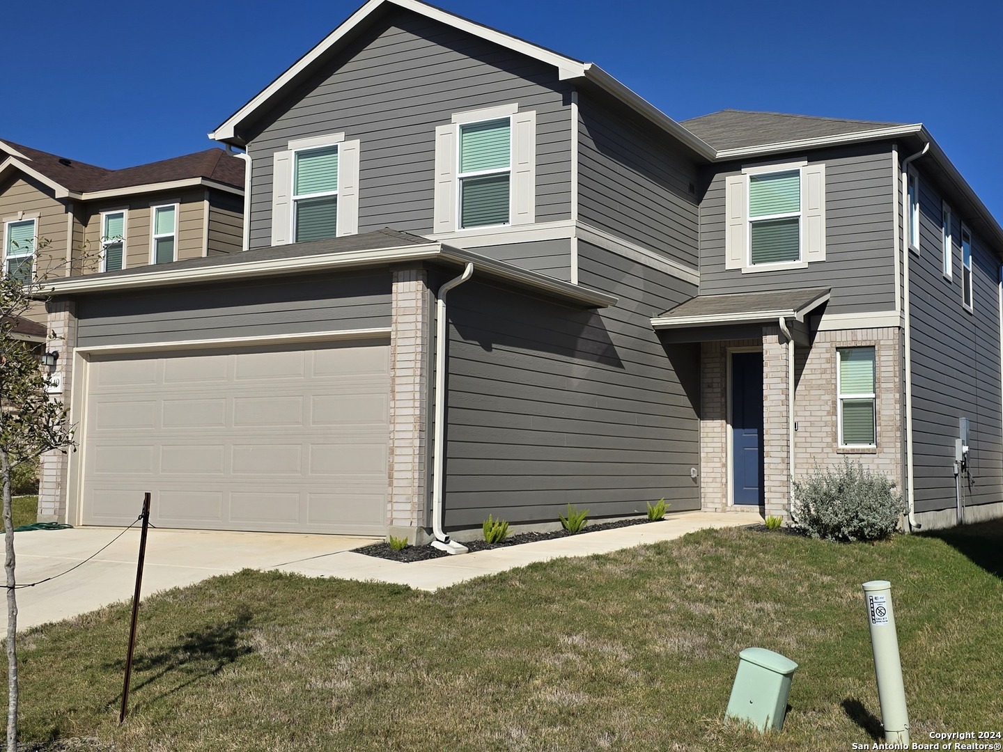 a front view of a house with a garage