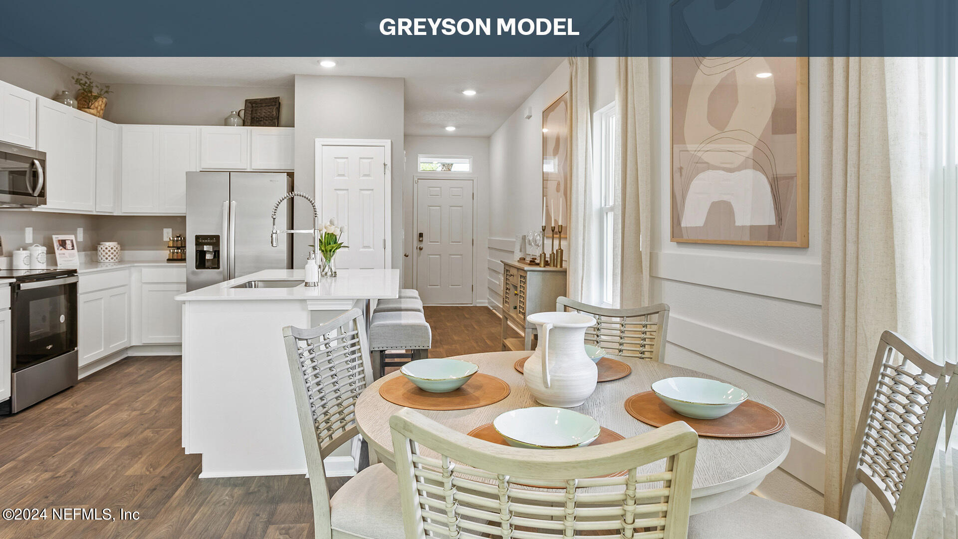 a living room with kitchen island furniture and a wooden floor