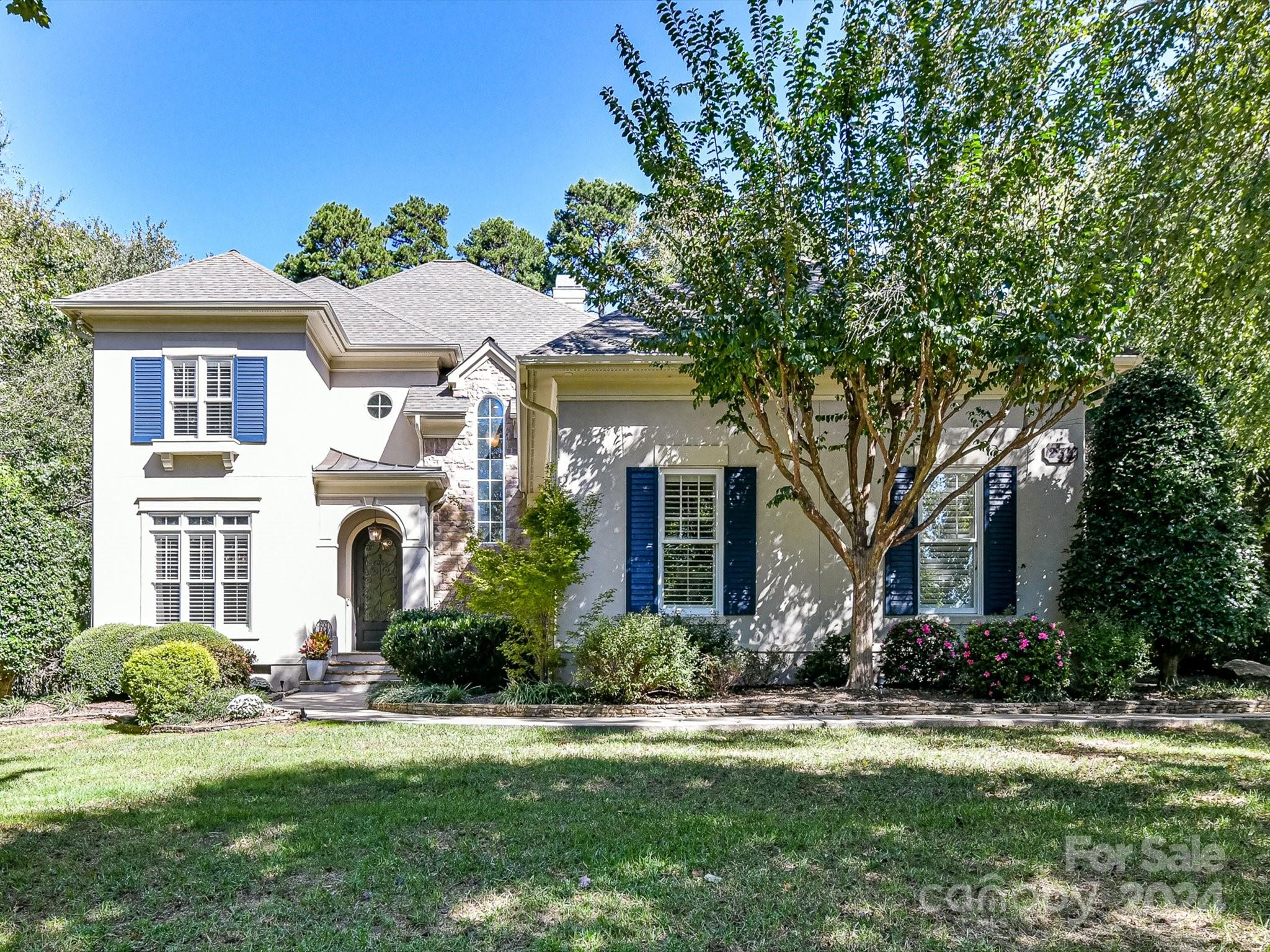 a front view of a house with a yard