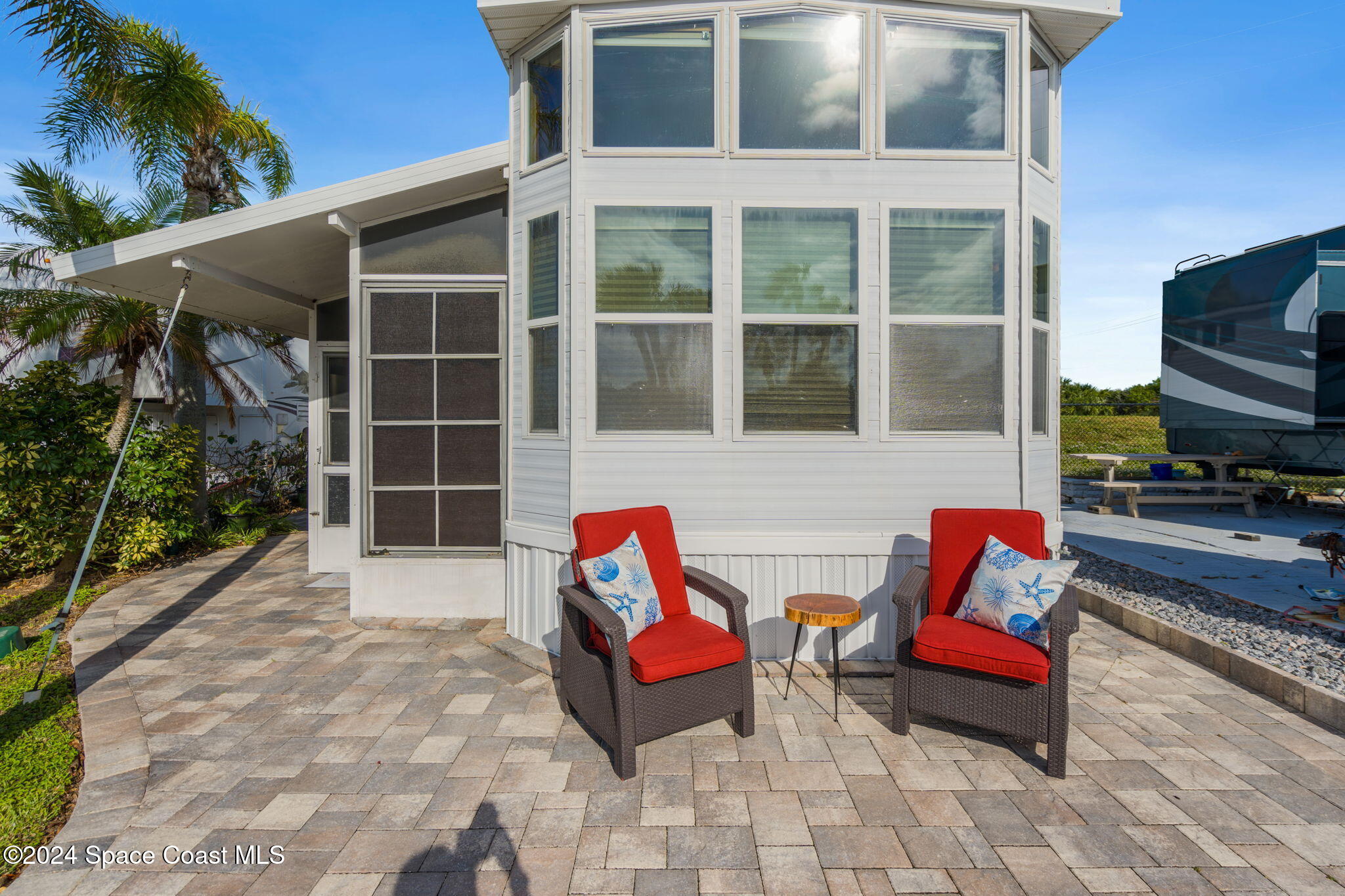 a backyard of a house with seating space