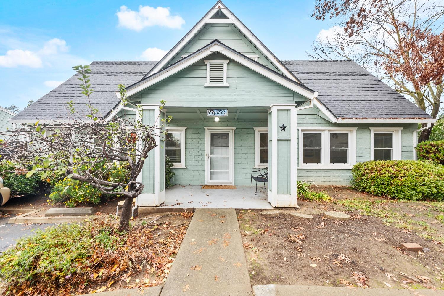 a front view of a house with garden