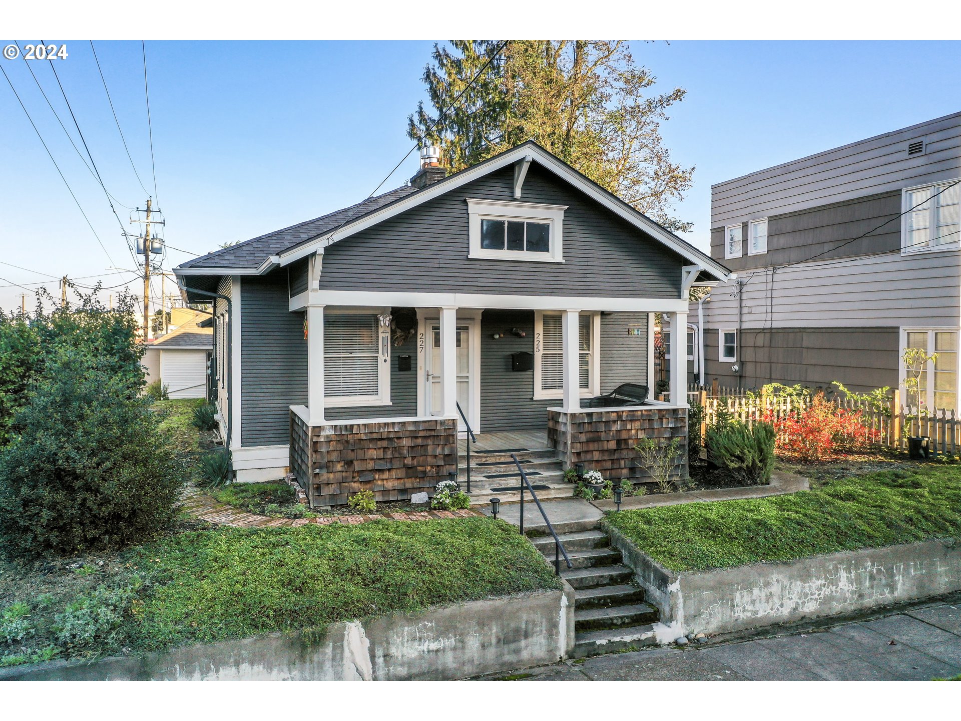 a front view of a house with garden