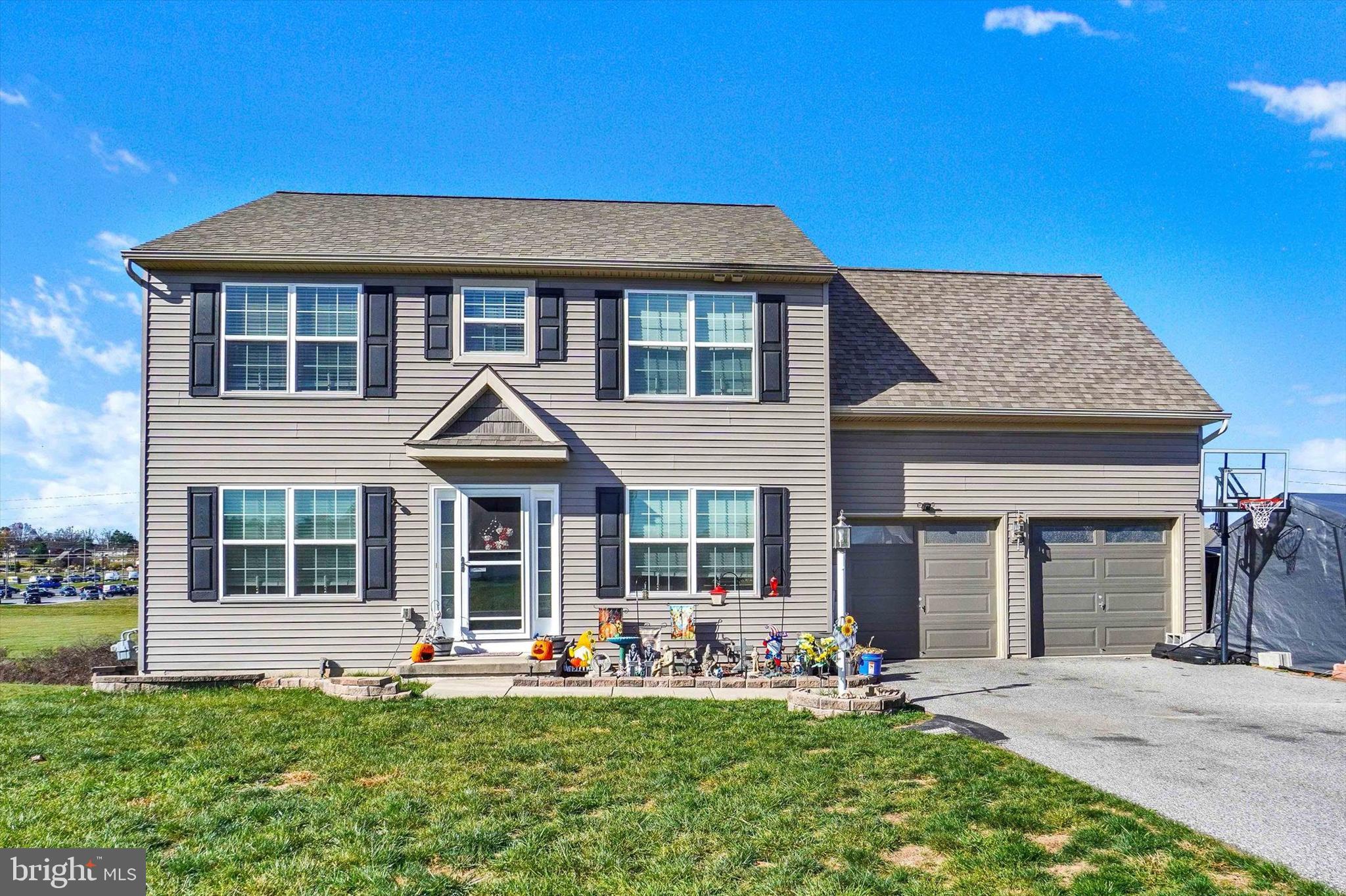 front view of a house with a yard