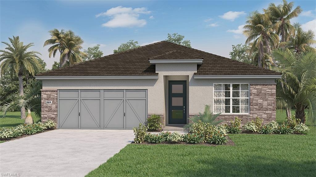 View of front of house featuring a garage and a front yard