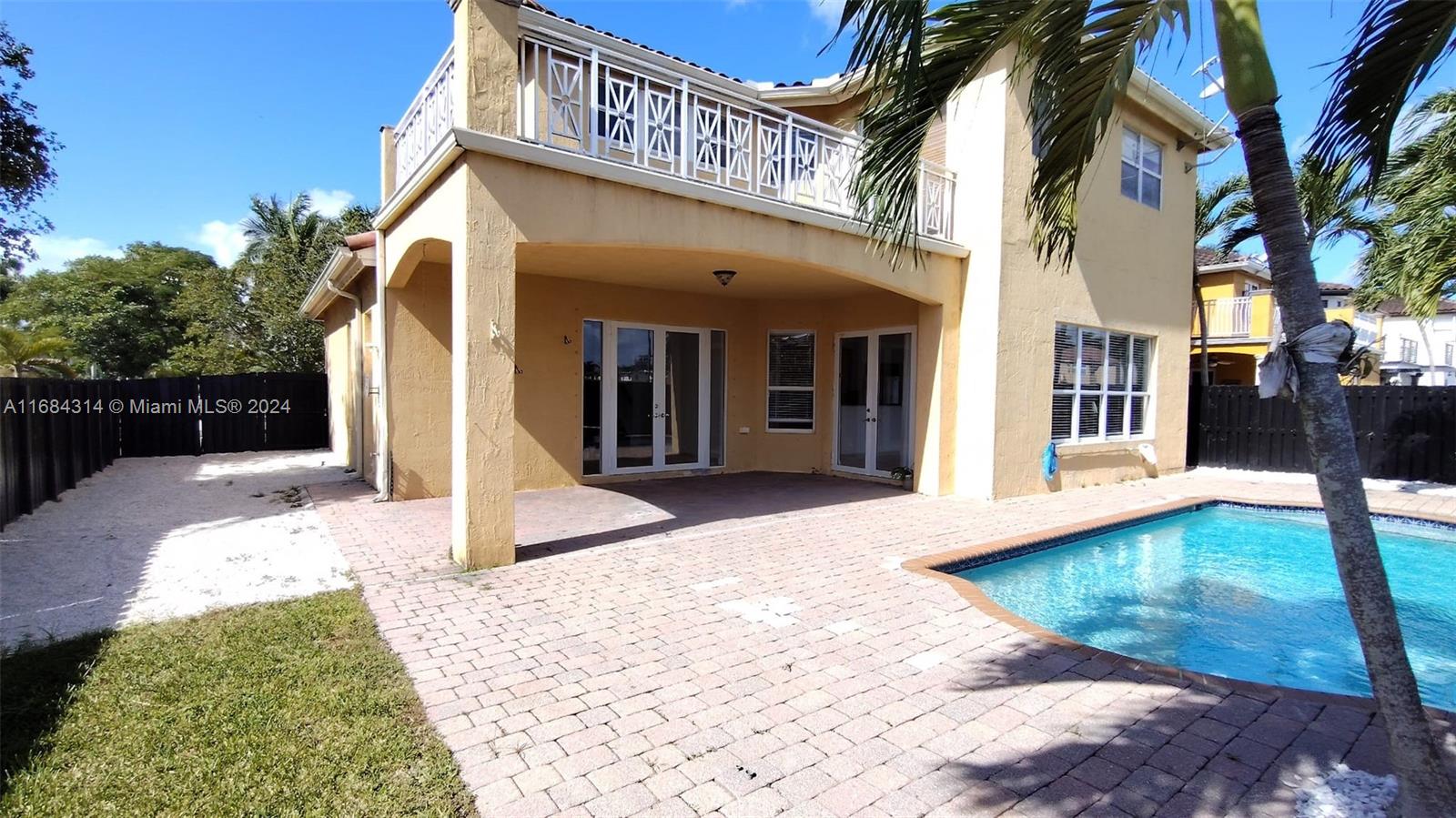 a view of a house with a swimming pool