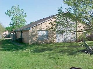 a backyard of a house with lots of green space