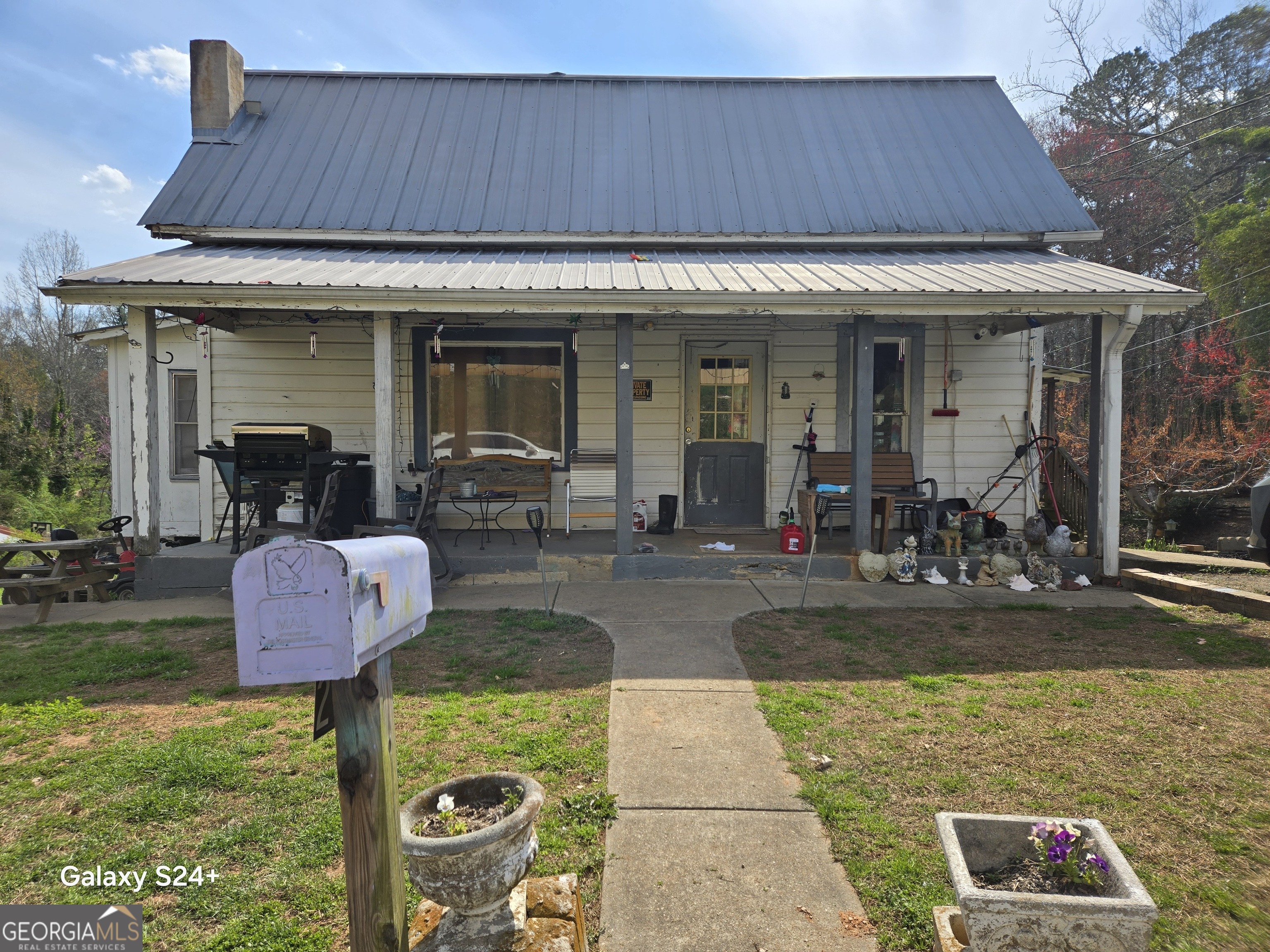 a view of a house with fountain bath tub and couches chairs