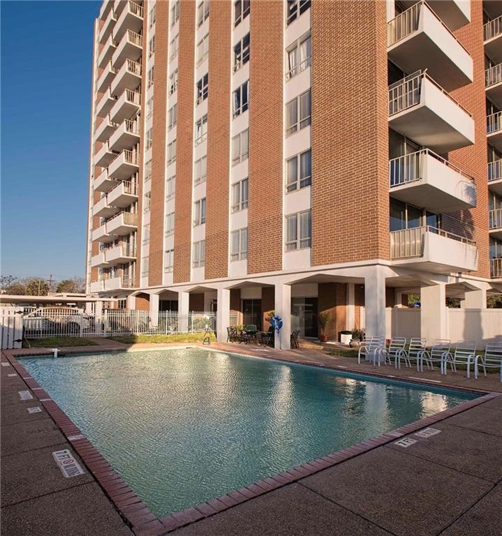 a view of swimming pool with outdoor seating