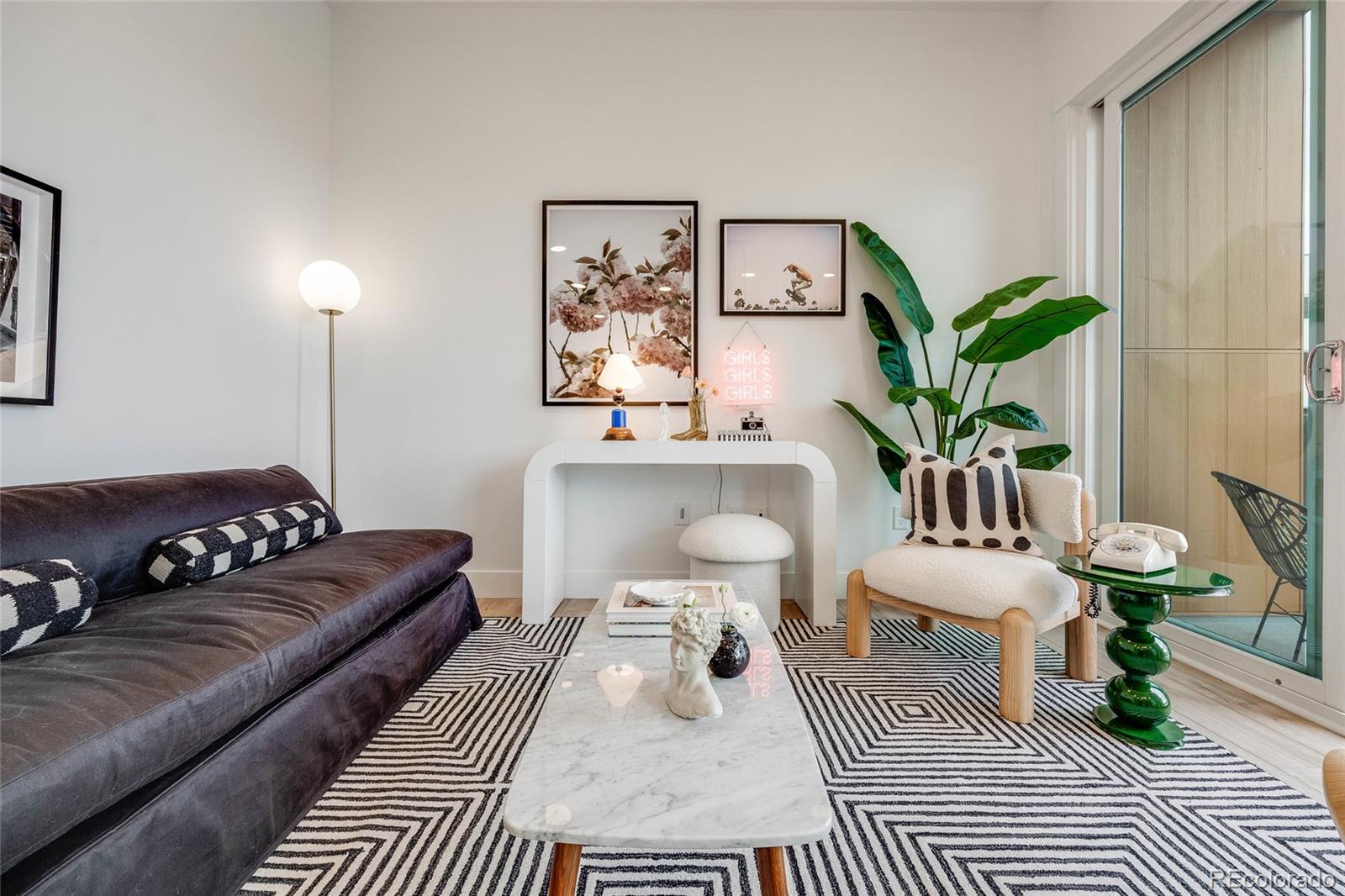 a living room with furniture and a rug