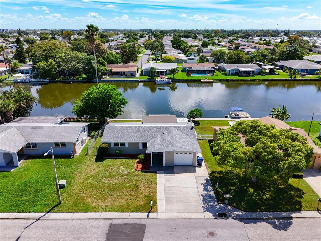 an aerial view of a house with a lake view