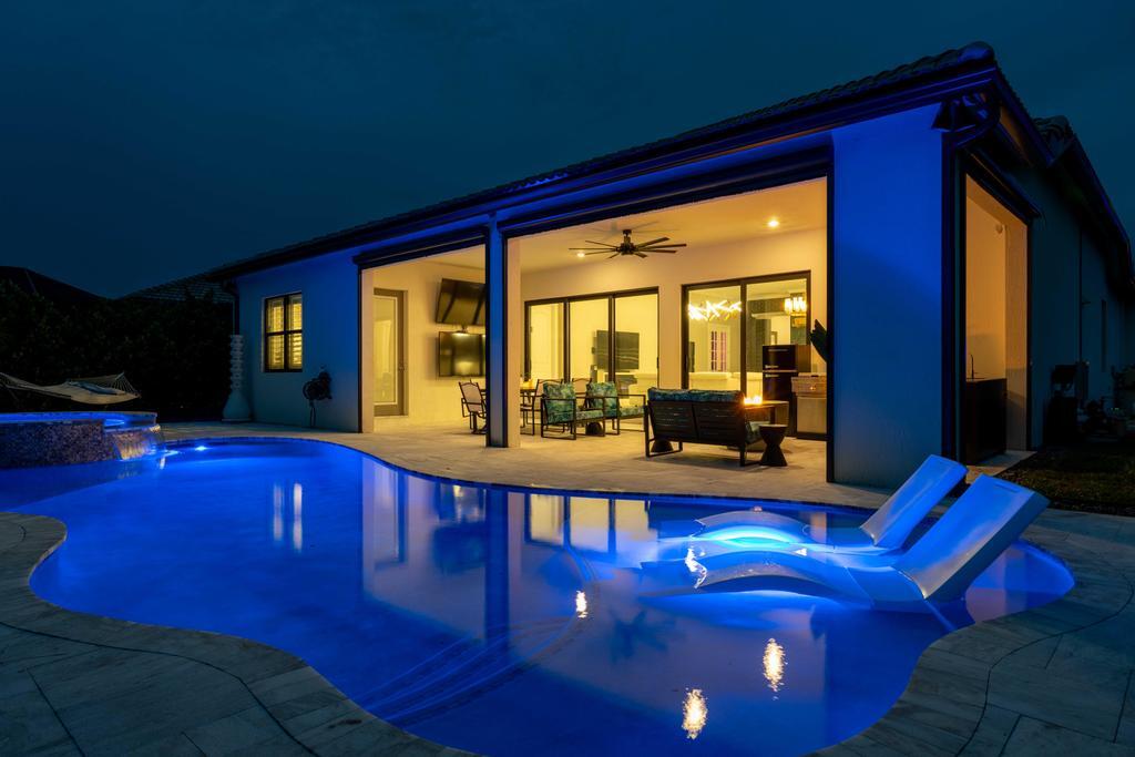 a view of swimming pool with seating area