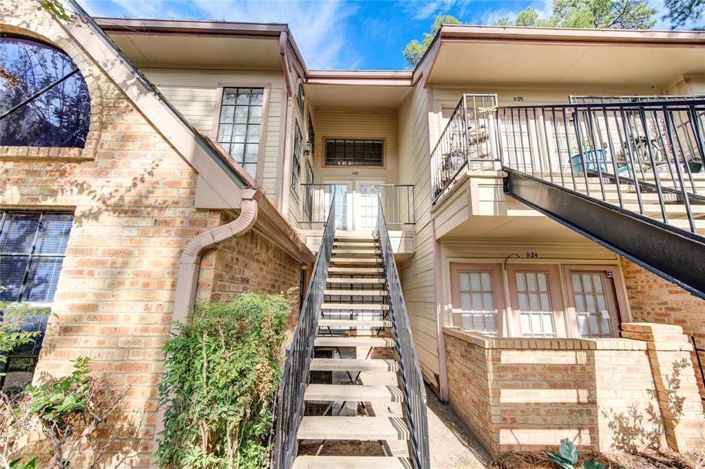 a view of a balcony with staircase