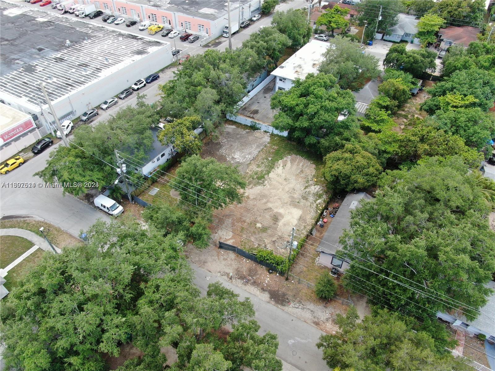 an aerial view of house with yard