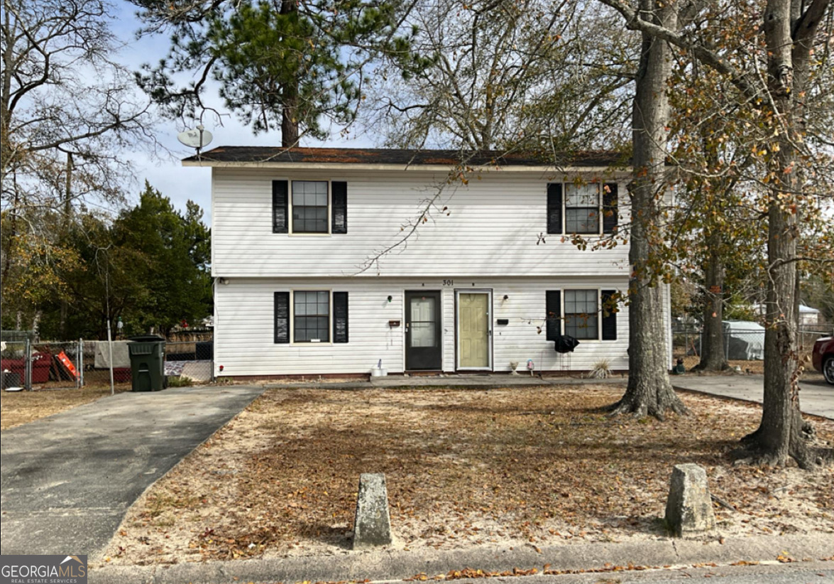 a front view of a house with yard