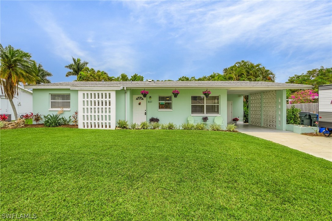 front view of a house with a yard