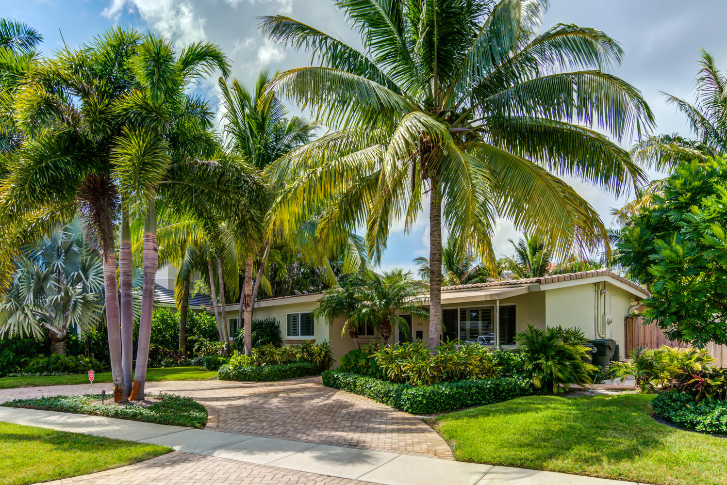 a front view of house and yard with green space