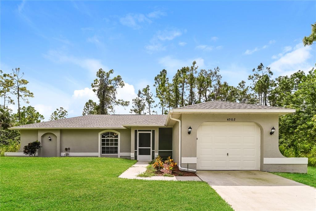 front view of a house with a yard