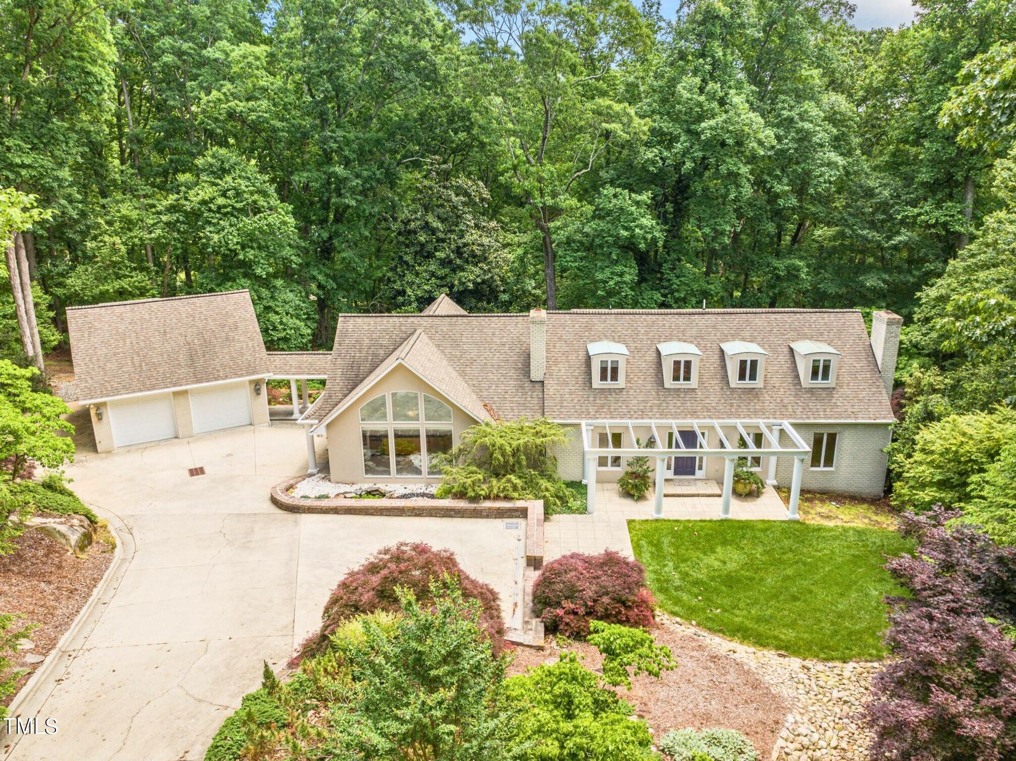 a view of an house with backyard space and balcony