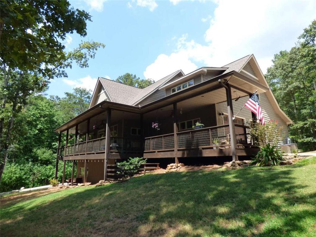 a view of house with backyard