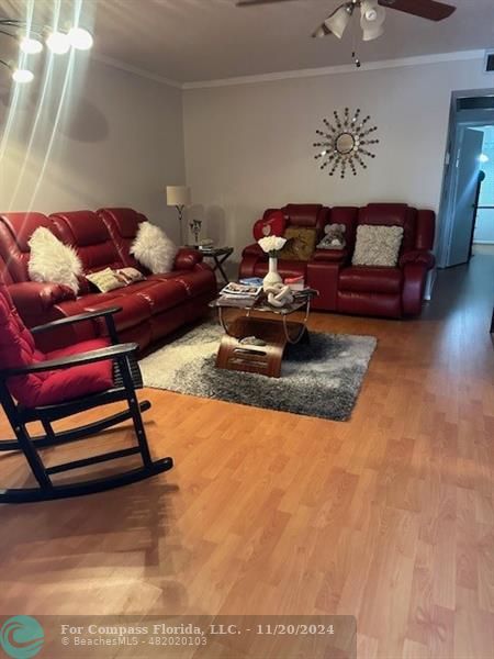 a living room with furniture and a rug