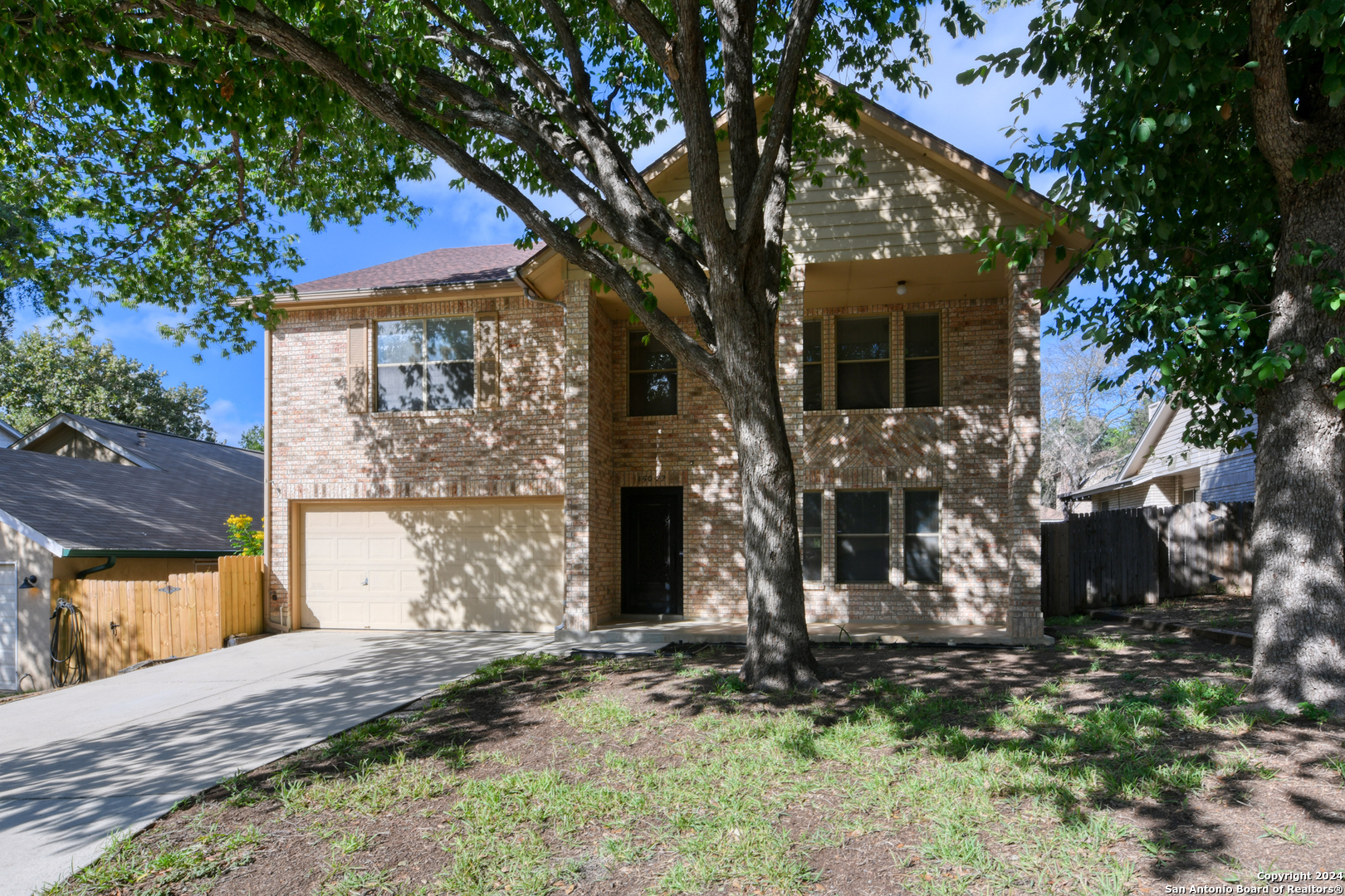 a view of a house with brick walls