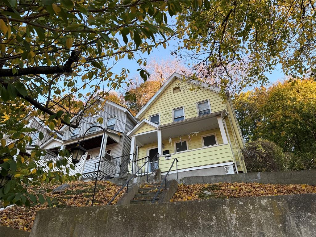 a house with trees in front of it