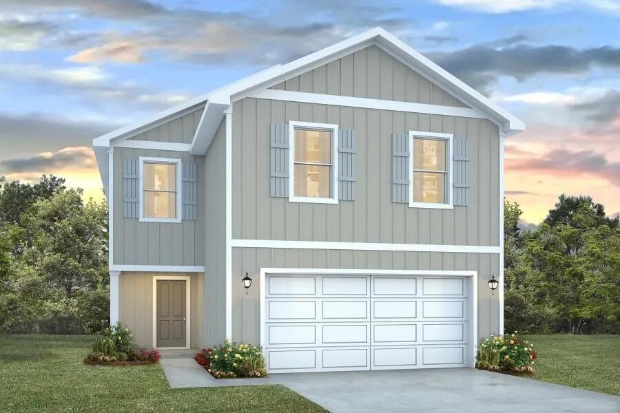 a view of backyard of house with garage