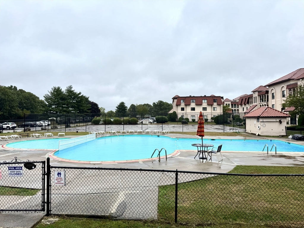 a view of a swimming pool with a patio