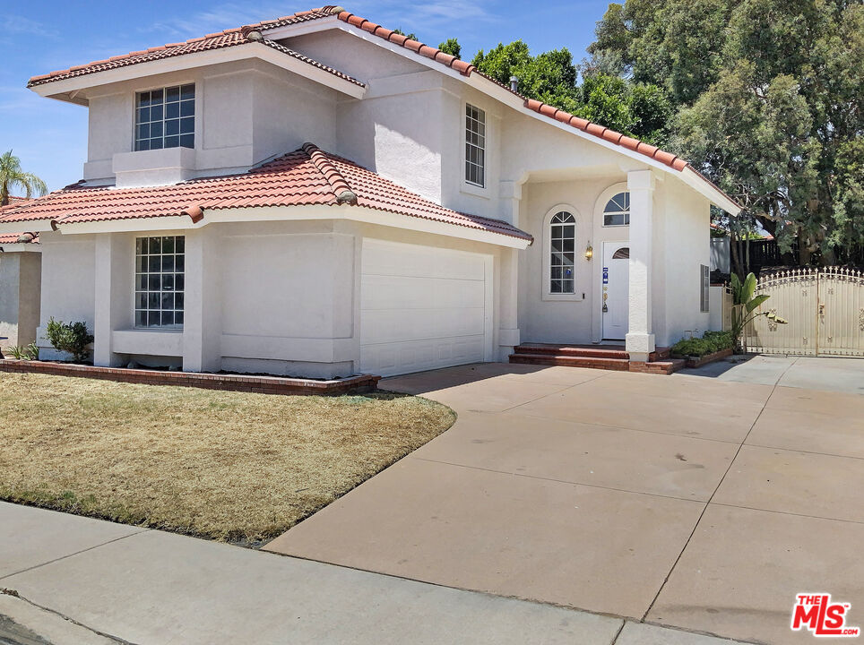 a front view of a house with garage