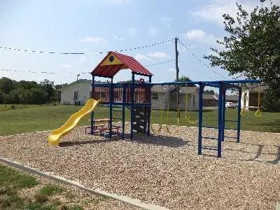 a view of a park with a slide