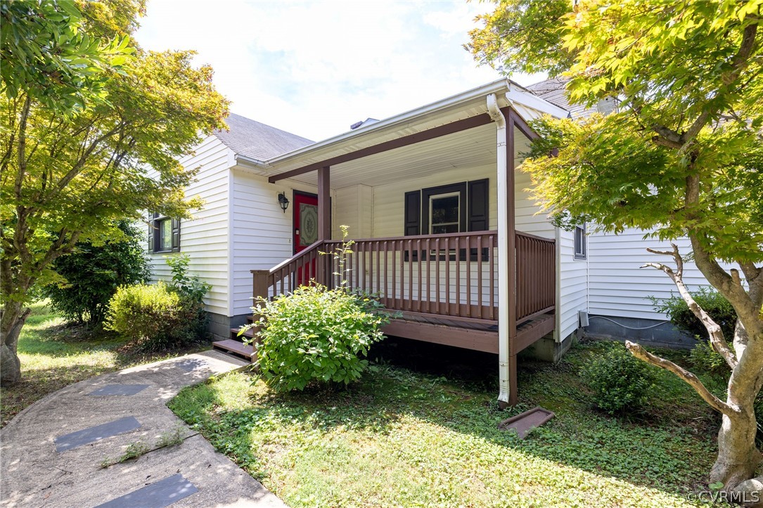 a view of a house with a yard and furniture