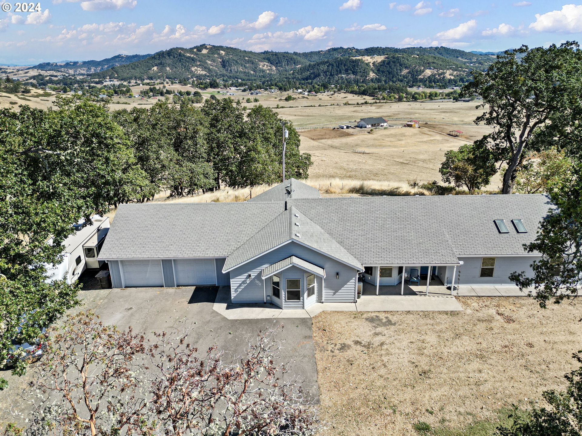 an aerial view of house with a yard